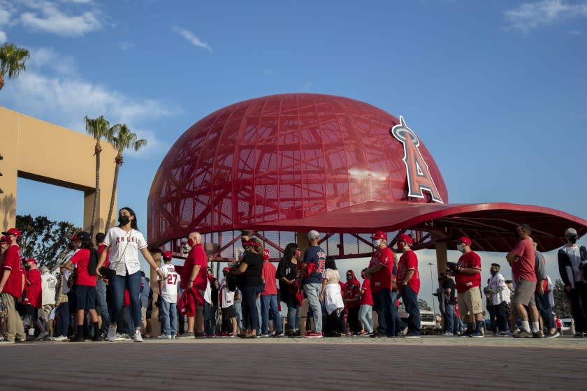 ANAHEIM, CA - APRIL 1, 2021: Fans line up to enter Angel Stadium for the Angels home opener.