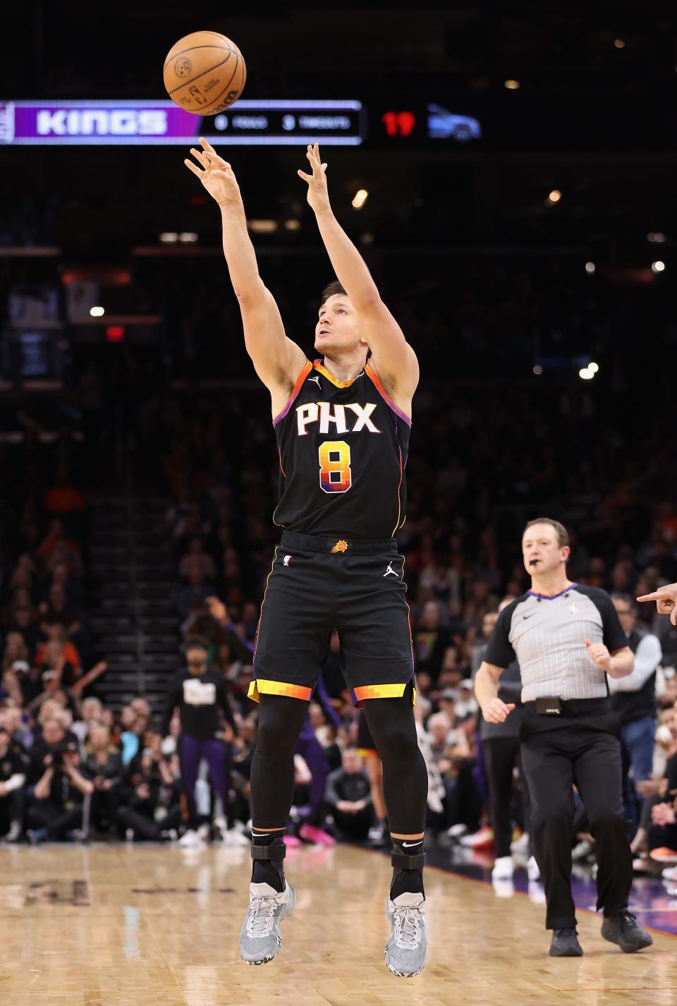 Grayson Allen #8 of the Phoenix Suns puts up a three-point shot against the Sacramento Kings during the second half of the NBA game at Footprint Center on Jan. 16, 2024 in Phoenix. The Suns defeated the Kings 119-117.