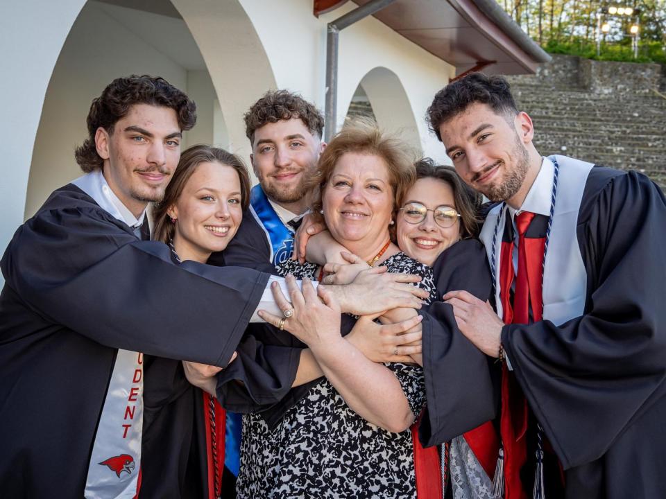 PHOTO: The quintuplets: Michael, Victoria, Ludovico, Ashley and Marcus celebrate their graduation with their mother Silvia Povolo. (Mike Peters for Montclair State University)