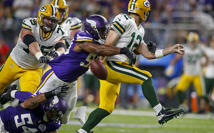 Sep 18, 2016; Minneapolis, MN, USA; Minnesota Vikings defensive end Danielle Hunter (99) sacks Green Bay Packers quarterback Aaron Rodgers (12) and forces a fumble in the first quarter at U.S. Bank Stadium. Mandatory Credit: Bruce Kluckhohn-USA TODAY Sports