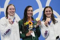 From left, Lilly King, of United States, Tatjana Schoenmaker, of South Africa, and Annie Lazor, of United States, pose at the podium after the women's 200-meter breaststroke final at the 2020 Summer Olympics, Friday, July 30, 2021, in Tokyo, Japan. (AP Photo/Gregory Bull)