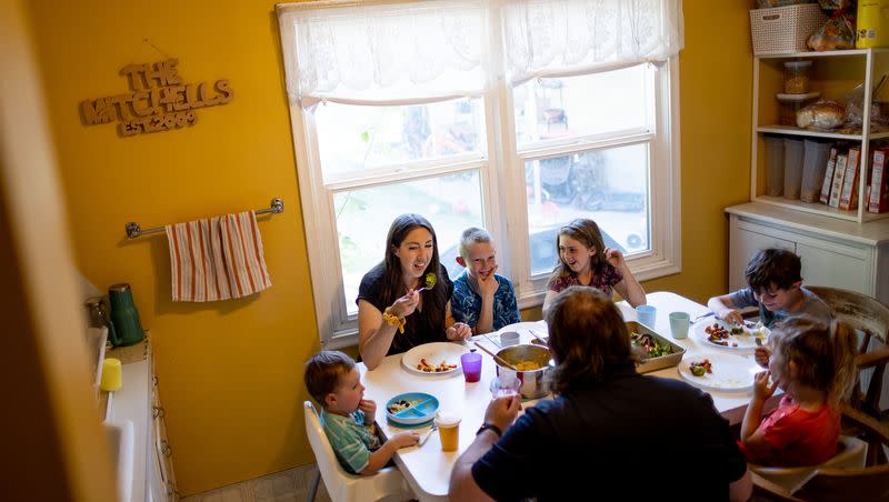 Aubrey and Josh Mitchell and their children, Conner, 1; Owen, 9; Zoey, 7; Elliot, 6; and Pyper, 4, eat dinner at their home in Midvale on Tuesday, May 30, 2023.