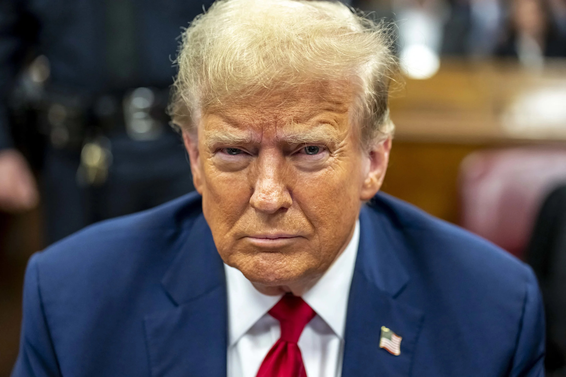 Former President Donald Trump looks at the camera during his trial.