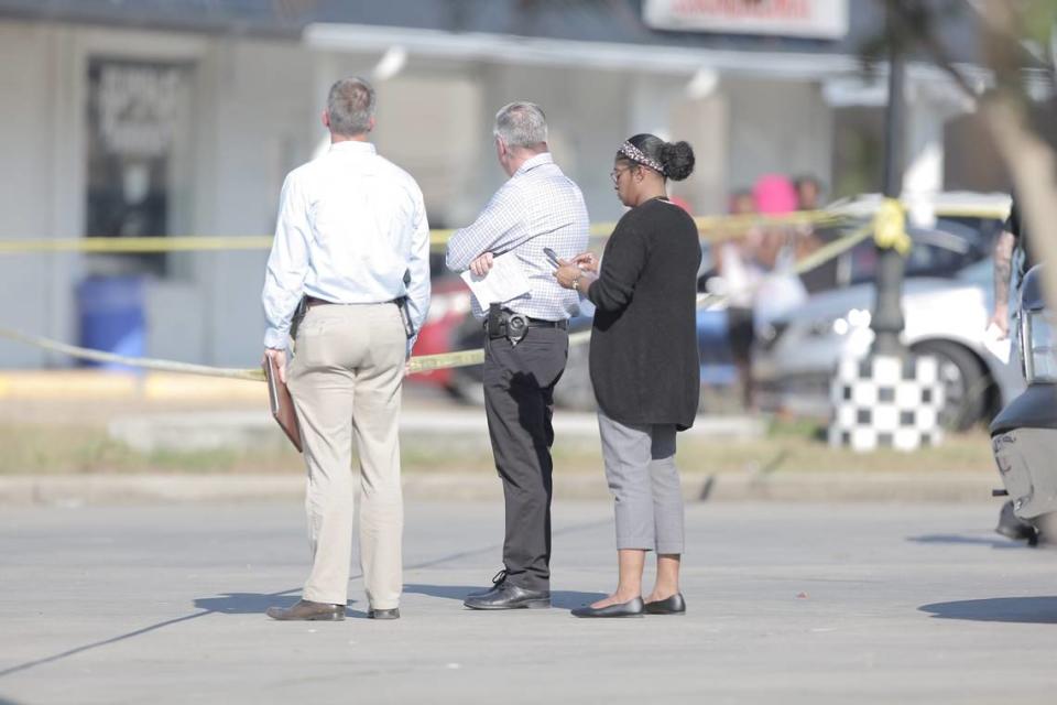 Investigators survey the scene outside of an officer involved shooting in Gulfport on October 6, 2022.