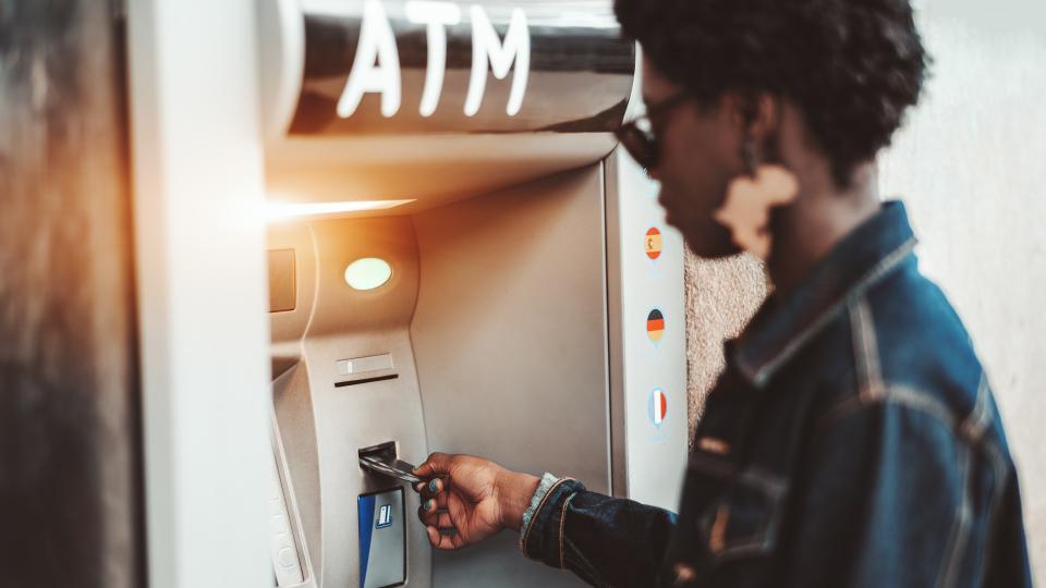 woman using atm machine