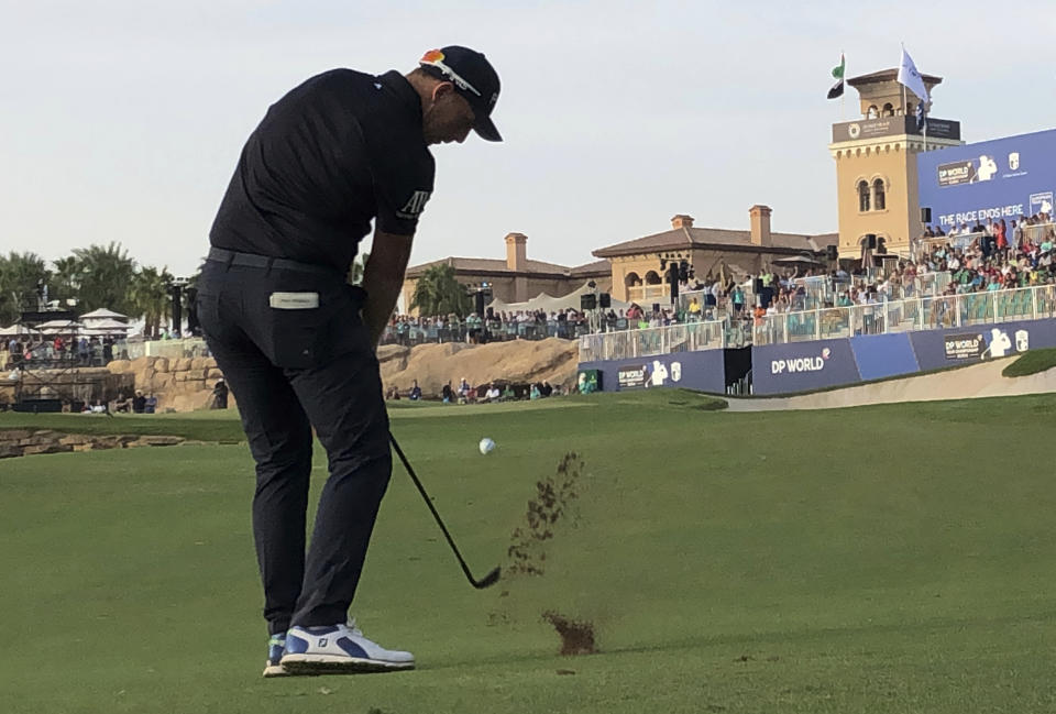 England's Matt Wallace plays a shot on the 18th hole during the second round of the DP World Tour Championship golf tournament in Dubai, United Arab Emirates, Friday, Nov. 16, 2018. (AP Photo/Kamran Jebreili)