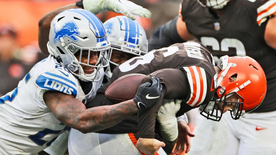 Detroit Lions safety Will Harris, left, sacks Cleveland Browns quarterback Baker Mayfield during the second half of an NFL football game, Sunday, Nov. 21, 2021, in Cleveland. (AP Photo/Ron Schwane)