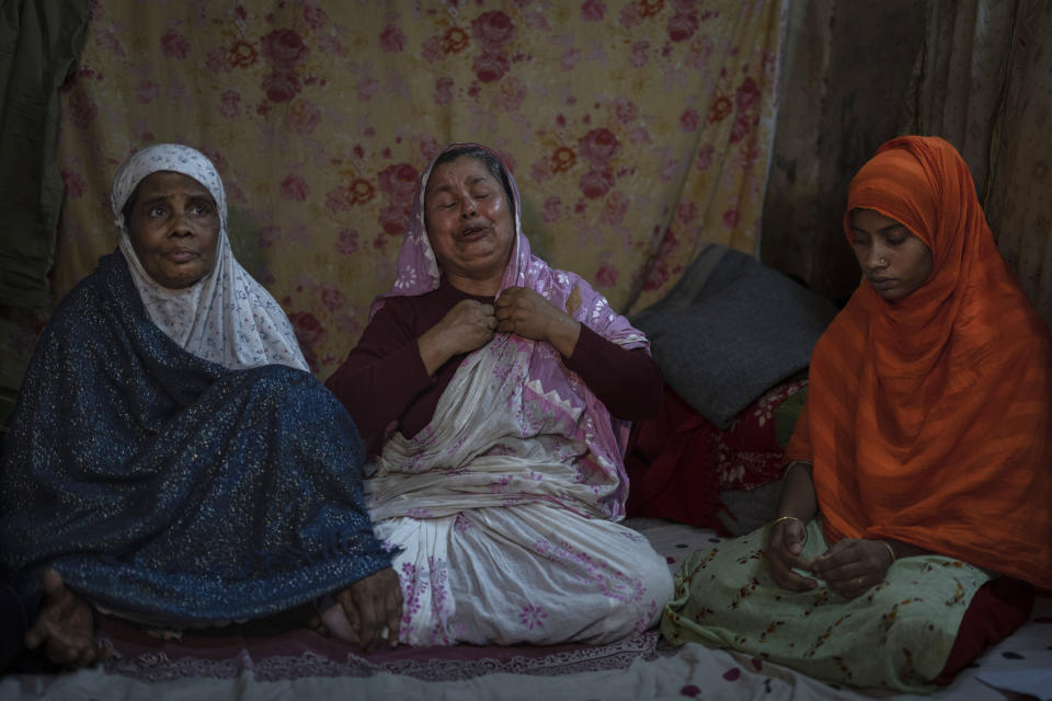 Nasima Akhter cries as she speaks about her brother Fazlur Rahman, a Bangladesh Nationalist Party activist, with his widow Rowshan Ara, left, and his daughter Khadiza Akhter sitting beside in Dhaka, Bangladesh, Thursday, Jan. 4, 2024. Kajol's family says he was arrested by police on Oct. 25 outside the tea stall he ran, and died in hospital over a week ago where he was taken from jail after he fell sick. (AP Photo/Altaf Qadri)