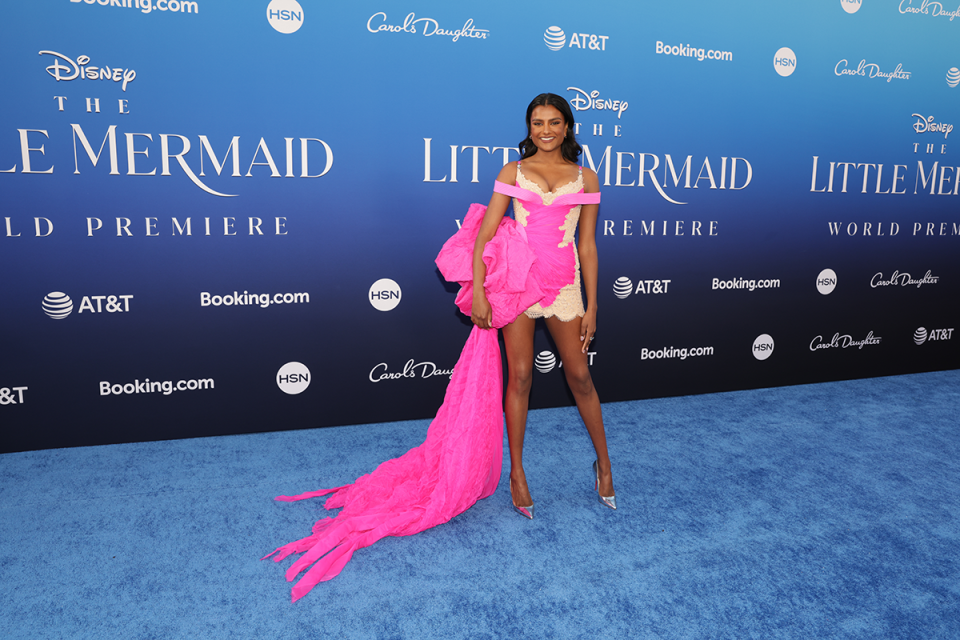 simone ashley wearing a versace pink lingerie dress