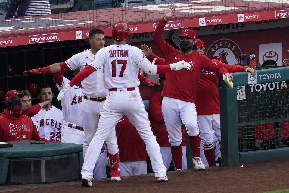 Los Angeles Angels' Shohei Ohtani (17) celebrates after hitting a home run during the first inning of a baseball game against the Chicago White Sox Sunday, April 4, 2021, in Anaheim, Calif. (AP Photo/Ashley Landis)