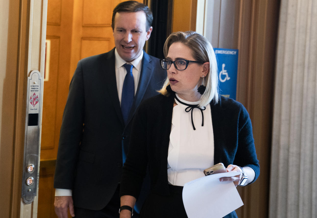 Sens. Kyrsten Sinema, D-Ariz., and Chris Murphy, D-Conn., are seen in the Capitol during a vote on Wednesday, May 26, 2021. (Tom Williams/CQ Roll Call via Getty Images)  