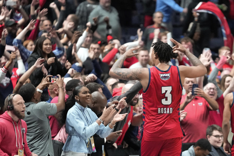 Florida Atlantic forward Giancarlo Rosado (3) celebrates after beating the Memphis Tigers 66-65 in first-round college basketball game in the NCAA Tournament Friday, March 17, 2023, in Columbus, Ohio. Florida Atlantic won 66-65. (AP Photo/Paul Sancya)