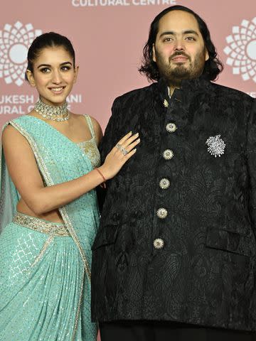 <p>SUJIT JAISWAL/AFP/Getty </p> Anant Ambani and Radhika Merchant during the inauguration of the Nita Mukesh Ambani Cultural Centre at the Jio World Centre in Mumbai on April 1, 2023..