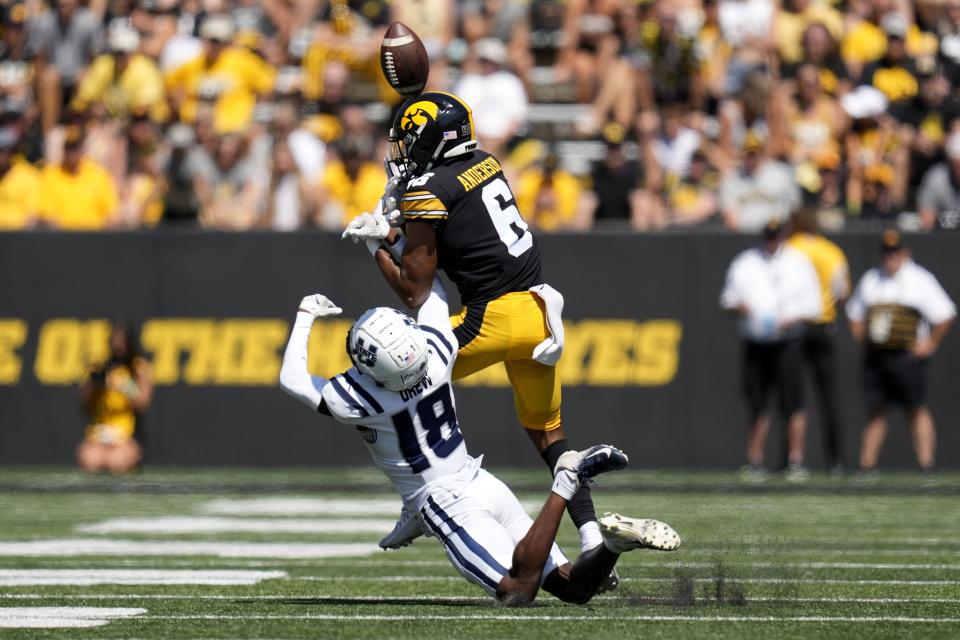 Utah State cornerback JD Drew (18) breaks up a pass intended for Iowa wide receiver Seth Anderson (6) during the first half of an NCAA college football game, Saturday, Sept. 2, 2023, in Iowa City, Iowa. (AP Photo/Charlie Neibergall) | AP