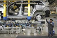 FILE - A worker assembles an SUV at a car plant of Li Auto, a major Chinese EV maker, in Changzhou in eastern China's Jiangsu province on March 27, 2024. The Biden administration is announcing plans to slap new tariffs on Chinese electric vehicles, advanced batteries, solar cells, steel, aluminum and medical equipment. (Chinatopix Via AP, File)