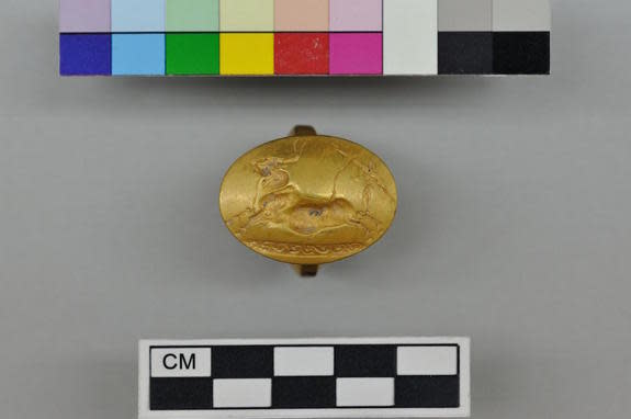 This gold ring with a Cretan bull-jumping scene was one of four solid-gold rings found in the tomb.