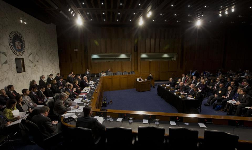 Director of National Intelligence James Clapper, center, testifies on Capitol Hill in Washington, Wednesday, Jan. 29, 2014, before the Senate Intelligence Committee hearing on current and projected national security threats against the US. From left are, National Counterterrorism Center Director Matthew Olsen, FBI Director James Comey, Clapper, CIA Director John Brennan, and Defense Intelligence Agency Director Lt. Gen. Michael Flynn. (AP Photo/Pablo Martinez Monsivais)