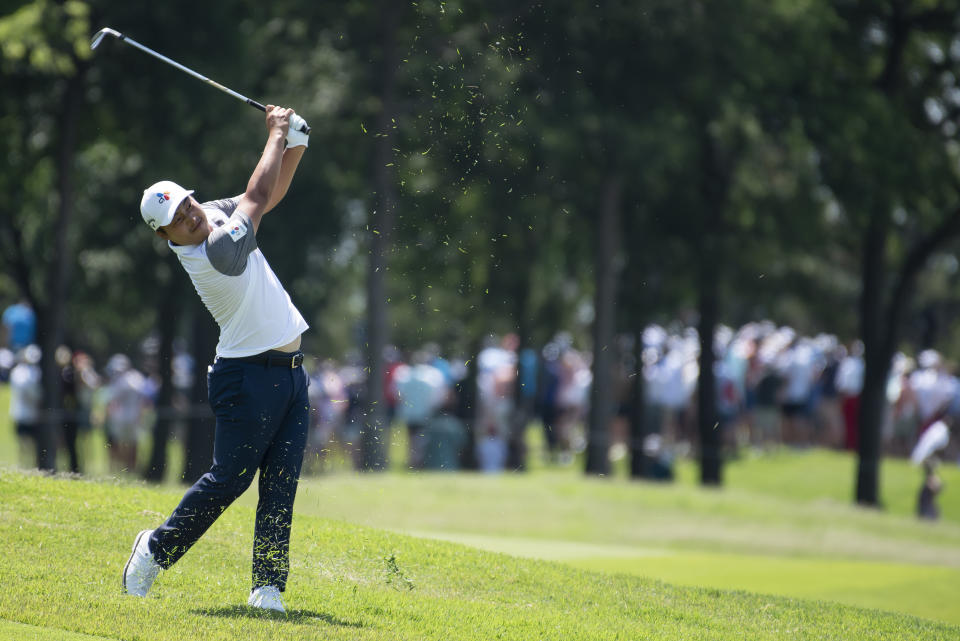 K.H. Lee, of South Korea, hits on the third hole during the fourth round of the AT&T Byron Nelson golf tournament in McKinney, Texas, on Sunday, May 15, 2022. (AP Photo/Emil Lippe)