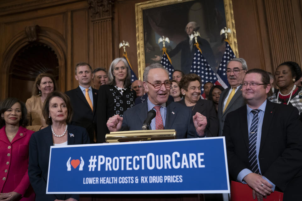 FILE - In this May 15, 2019 file photo, Senate Minority Leader Chuck Schumer, D-N.Y. , center, with House Speaker Nancy Pelosi, D-Calif., left, rallies House and Senate Democrats ahead of a House floor vote on the Health Care and Prescription Drug Package, at the Capitol in Washington. Health care is on the agenda for Congress when lawmakers return, and it’s not another battle over the Obama-era Affordable Care Act. Instead of dealing with the uninsured, lawmakers are trying to bring down costs for people who already have coverage. (AP Photo/J. Scott Applewhite)