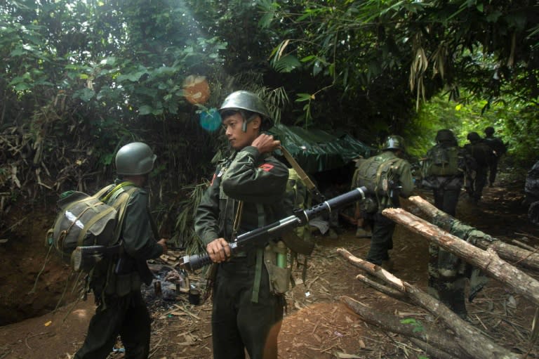 Armed rebels belonging to the Kachin Independence Army (KIA) ethnic group move towards the frontline near Laiza, in northern Myanmar's Kachin state