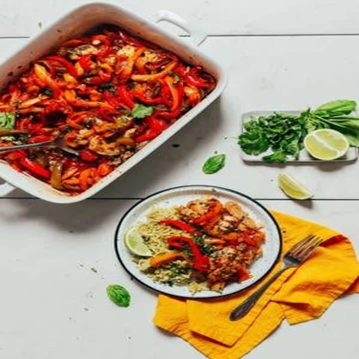 Herb Baked Fish With Rainbow Bell Peppers in a pan and on a plate