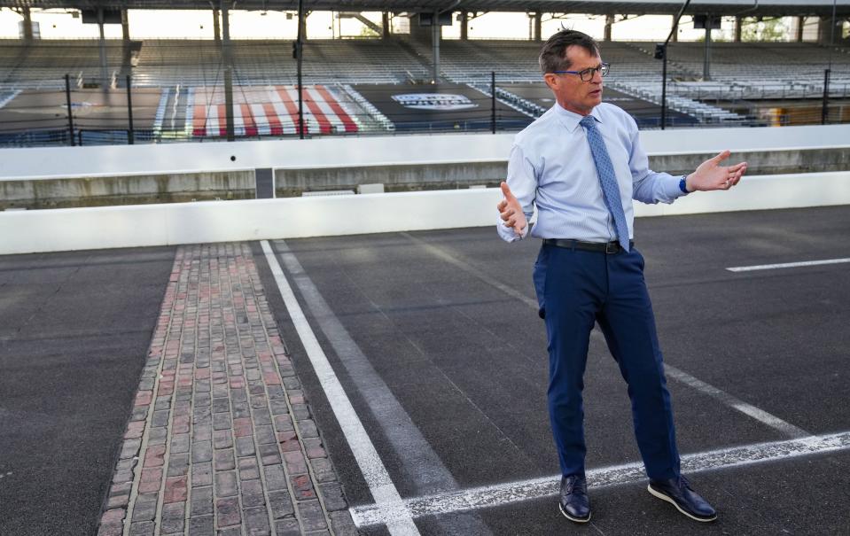 Doug Boles is interviewed in the pit lane by the Yard of Bricks on Thursday, April 18, 2024, at The Indianapolis Motor Speedway.