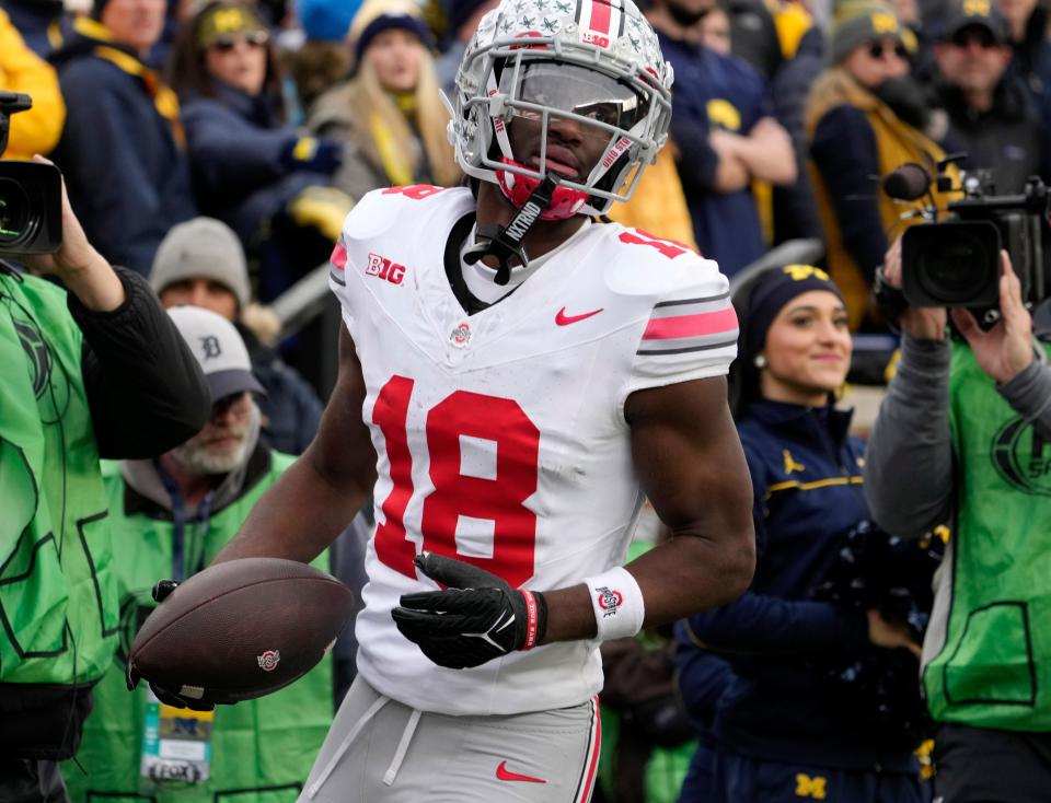 Nov. 25, 2023; Ann Arbor, Mi., USA;
Ohio State Buckeyes wide receiver Marvin Harrison Jr. (18) scores a touchdown during the second half of Saturday's NCAA Division I football game against the University of Michigan.