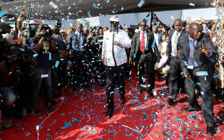 Kenyan opposition leader Raila Odinga of the National Super Alliance (NASA) coalition celebrates as he is announced as the presidential candidate for the 2017 general elections during a rally at the Uhuru Park grounds, in Nairobi, Kenya, April 27, 2017. REUTERS/Thomas Mukoya