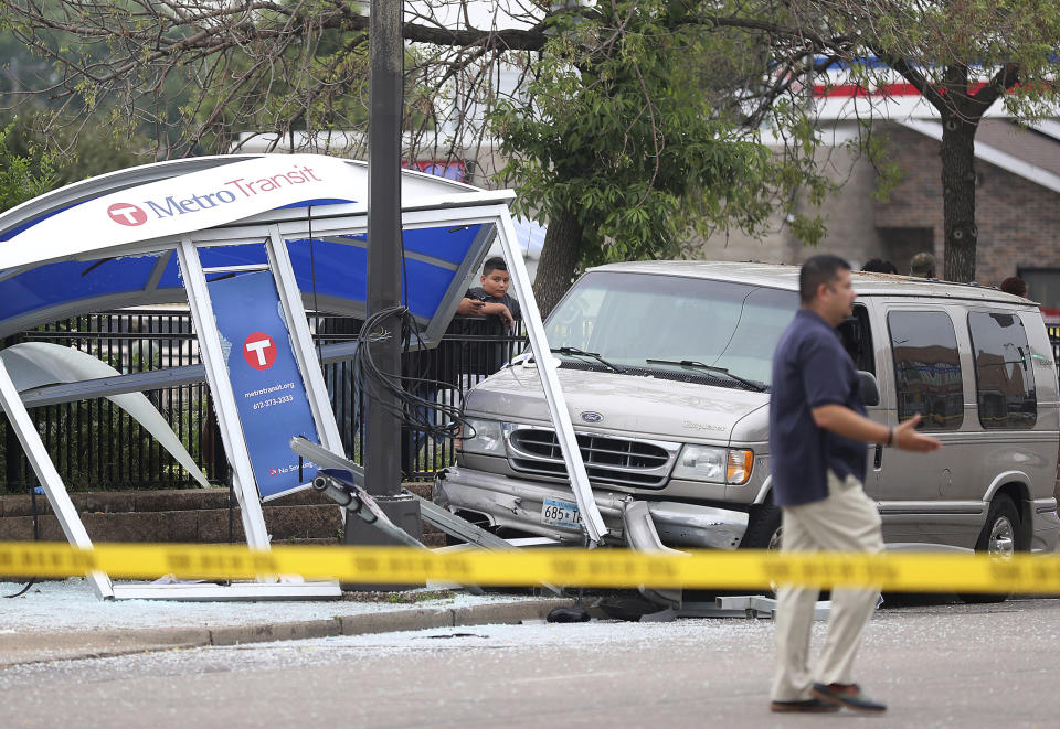 At least six people were hurt, including three critically, when a van slammed into a crowded bus stop shelter in north Minneapolis. All six were transported to hospitals. Metro Transit spokesman Howie Padilla says police took the driver of the van into custody following the crash about 9:30 a.m. Tuesday, July 9, 2019. (David Joles/Star Tribune via AP)