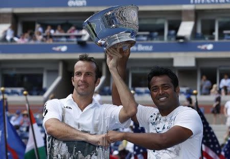 Leander Paes of India (R) and playing partner Radek Stepanek of the Czech Republic pose with their trophy after they defeated Alexander Peya of Austria and Bruno Soares of Brazil in their men's doubles final match at the U.S. Open tennis championships in New York September 8, 2013. REUTERS/Adam Hunger