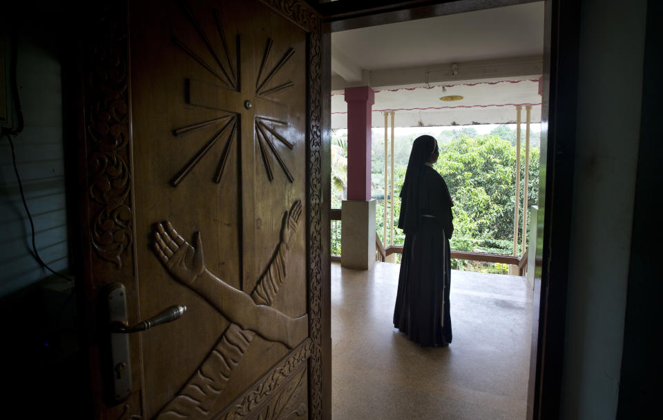 In this Saturday, Nov. 3, 2018, photo, a Catholic nun stands at the foyer of the St. Francis Mission Home in Kuravilangad in the southern Indian state of Kerala. For decades, nuns in India have quietly endured sexual pressure from Catholic priests, an AP investigation has revealed. (AP Photo/Manish Swarup)