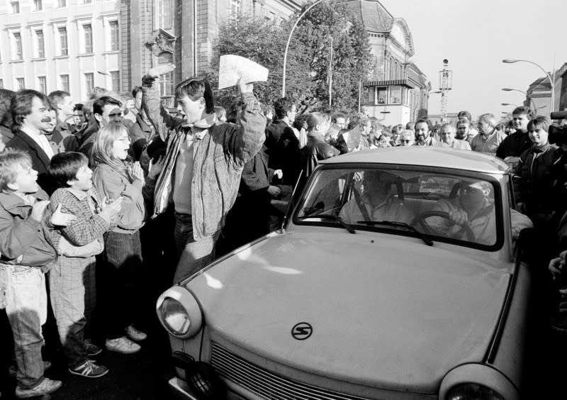 FILE PHOTO: West Berlin citizens welcome East Germans who came across the Berlin Wall in 1989