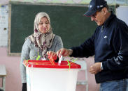 A Tunisian votes in the second round of the legislative elections in Tunis, Sunday, Jan. 29, 2023. Tunisia's president and its shaky democracy are facing an important test Sunday as voters cast ballots in the second round of parliamentary elections. Turnout was just 11% in the first round of voting last month. (AP Photo/Hassene Dridi)