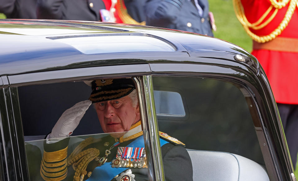 King Charles III salutes during Queen Elizabeth II's state funeral. (Bloomberg / Getty Images)