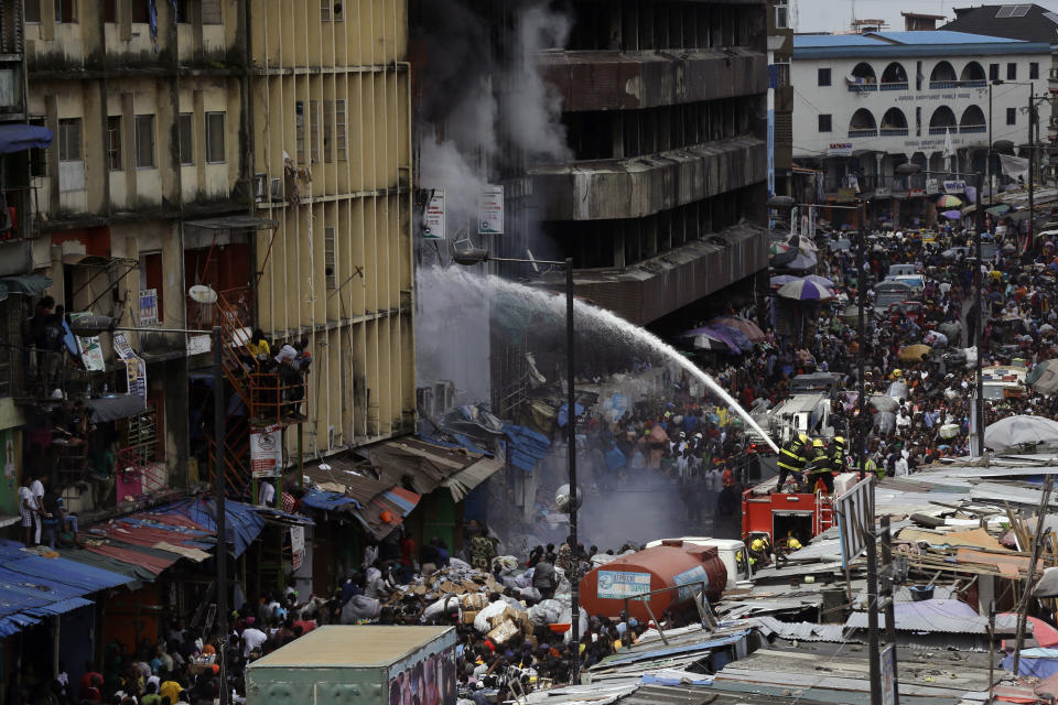 Smoke rises from a fire in downtown Lagos, Nigeria, Tuesday, Nov. 5, 2019. (Photo: Sunday Alamba/AP)