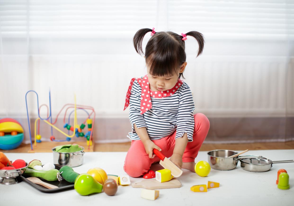 kid playing with toys