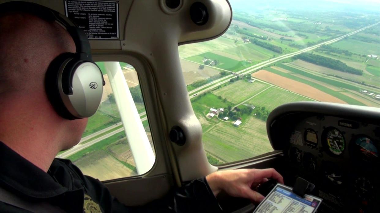 A Wisconsin State Patrol trooper conducts aerial traffic enforcement.