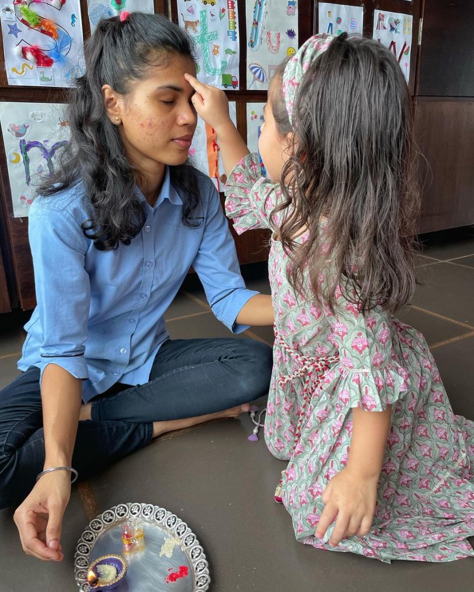 Inaaya tying a rakhi