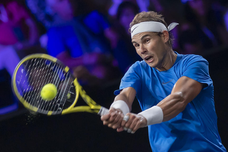 Team Europe's Rafael Nadal returns a ball to Team world's Milos Raonic during their singles match at the Laver Cup tennis event, in Geneva, Switzerland, Saturday, Sept. 21, 2019. (Martial Trezzini/Keystone via AP)