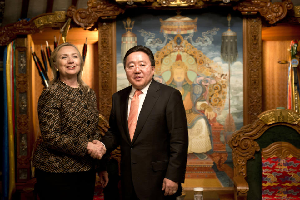 U.S. Secretary of State Hillary Rodham Clinton, left, is greeted by Mongolian President Elbegdorj Tsakhia during their meeting at the President's Yurt Monday, July 9, 2012 in Ulan Bator, Mongolia. (AP Photo/Brendan Smialowski, Pool)