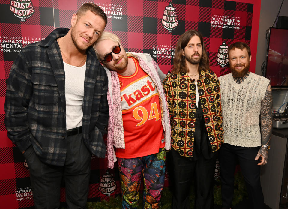 INGLEWOOD, CALIFORNIA - DECEMBER 10: (L-R) Dan Reynolds, Daniel Platzman, Wayne Sermon and Ben McKee of Imagine Dragons attend Audacy's "KROQ Almost Acoustic Christmas" at The Kia Forum on December 10, 2022 in Inglewood, California. (Photo by Lester Cohen/Getty Images for Audacy)