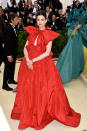 <p>Oscar-winner Anne Hathaway went for this scarlett Valentino gown on the night, with a spikey gold headpiece. Photo: Getty Images </p>