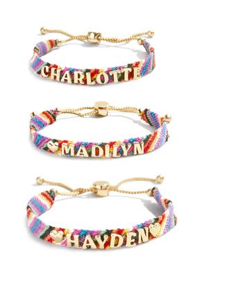 A personalized friendship bracelet with a metal clasp