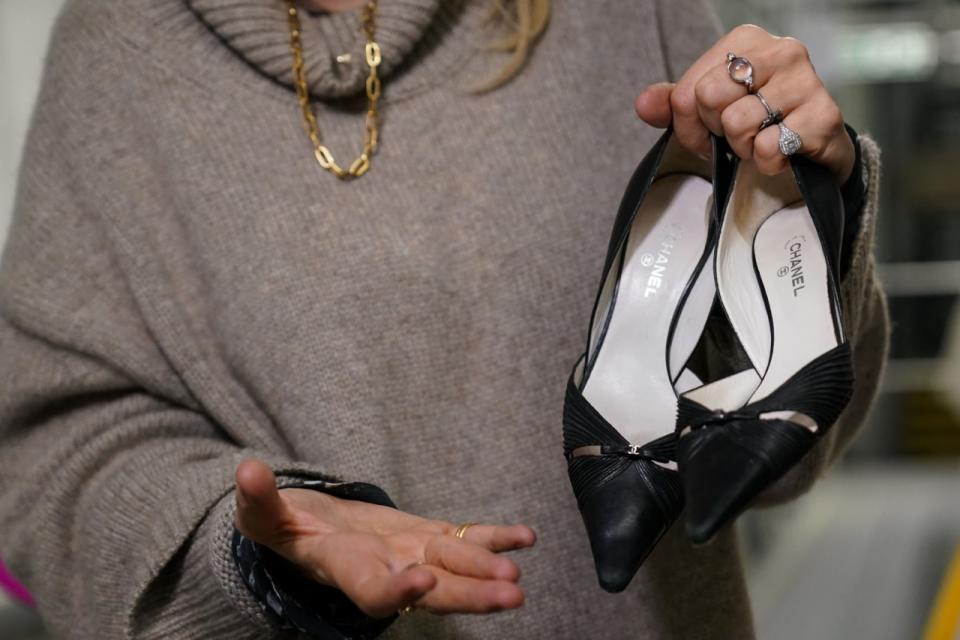 Bay Garnett with second-hand shoes from the Oxfam fashion collection (Jacob King/PA)