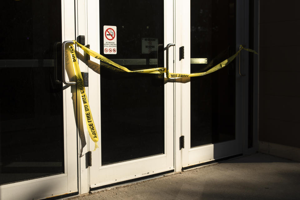 Police tape cordons off a door following a stabbing at the University of Waterloo, in Waterloo, Ontario, Wednesday, June 28, 2023. Waterloo Regional Police said three victims were stabbed inside the university's Hagey Hall, and a person was taken into custody. (Nick Iwanyshyn/The Canadian Press via AP)