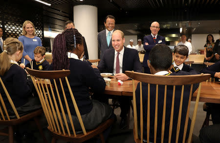 Britain's Prince William joins local school children from St Cuthbert with St Matthias CE Primary School at a copper beating workshop during the official opening of Japan House in London, Britain, September 13, 2018. Tim P. Whitby/Pool via REUTERS