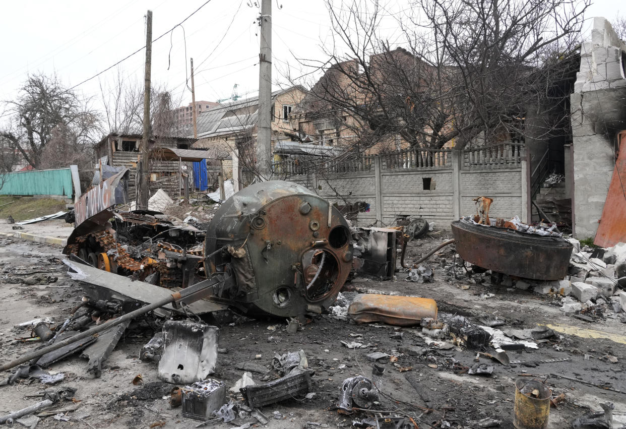 A destroyed Russian military vehicle in a Bucha street, close to Kyiv, Ukraine, Tuesday, April 5, 2022. (AP Photo/Efrem Lukatsky)