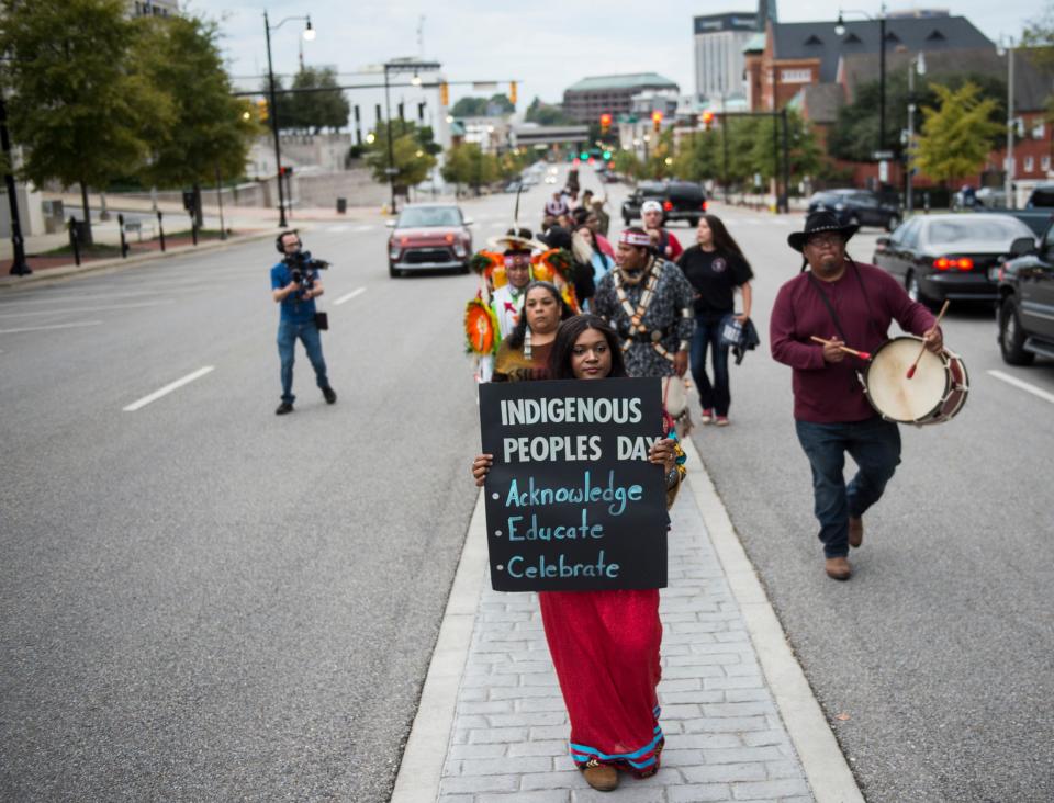 Alabama Indigenous Coalition members and supporters march on Dexter Ave. in Montgomery, Ala., on Monday, Oct. 14, 2019.