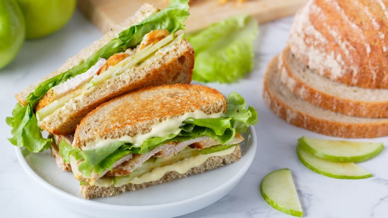 Cut turkey apple sandwich on a plate