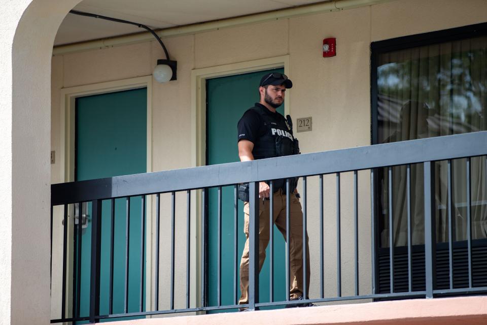 Law enforcement officials respond to the Baymont Inn & Suites on North Monroe Street, where two men were taken in for questioning Monday, Sept. 25, 2023. TPD said investigators were trying to determine whether the men were involved in the shooting that injured an officer earlier in the day.
